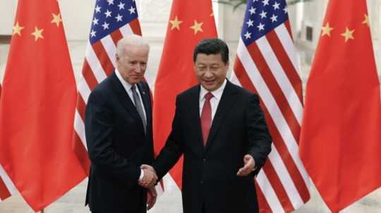 Si-Ťin Pching a americký prezident Joe Biden.
