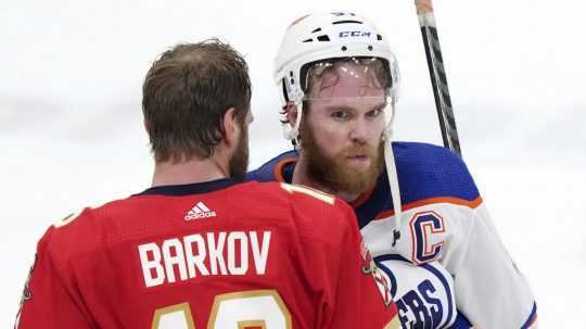 Connor McDavid (97) is consoled by Florida Panthers forward Aleksander Barkov